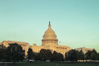 A panoramic 360 image showcasing the ornate facade of a historic government building under clear skies.