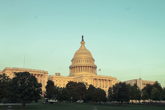 A panoramic 360 image showcasing the ornate facade of a historic government building under clear skies.