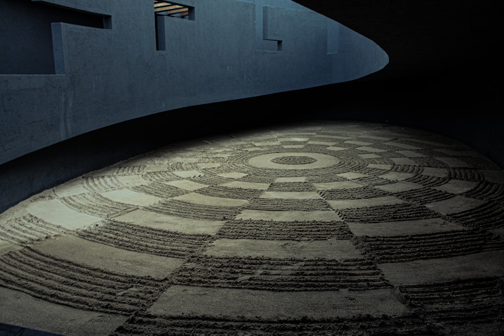 a circular pattern on the ground in front of a building
