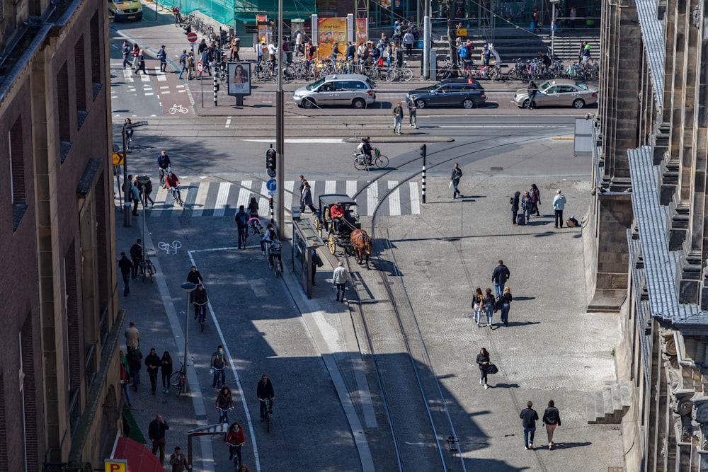 aerial photography of people on street near buildings during daytime