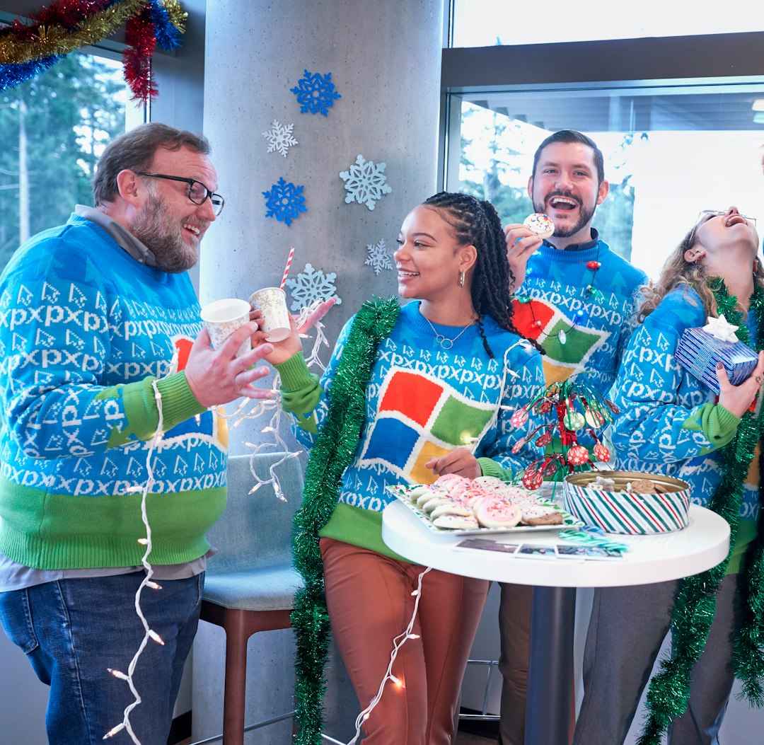 men and women wearing Windows sweater