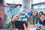 A family smiling warmly together inside a Snapbooth during a holiday celebration.