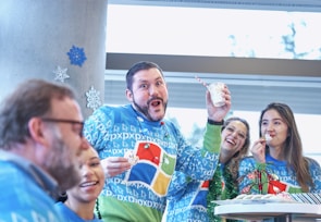 Families enjoying a festive celebration with joyful expressions.