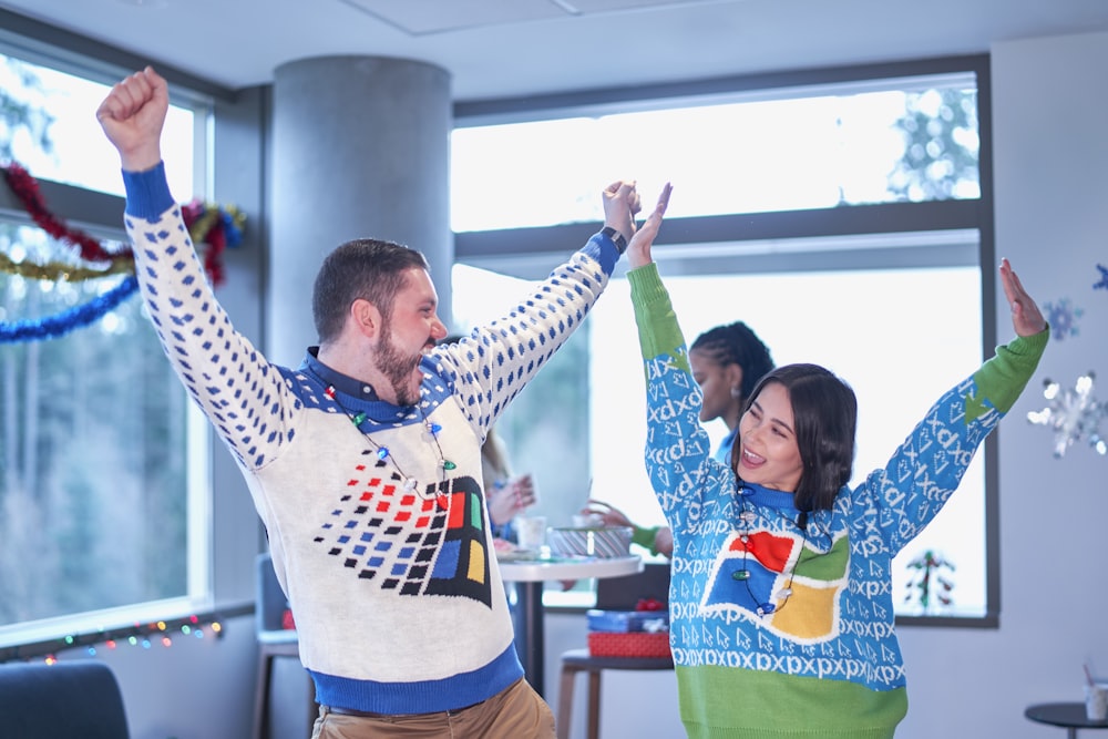 a man and a woman dancing in a living room