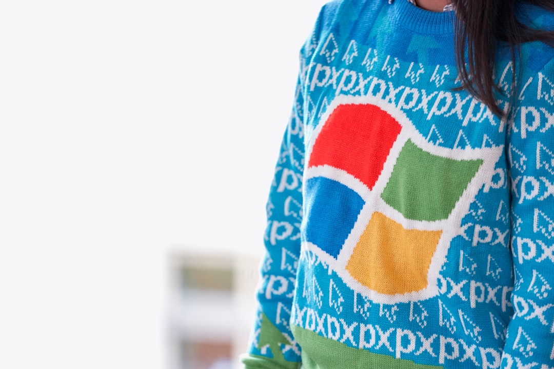 woman wearing blue Windows XP sweater