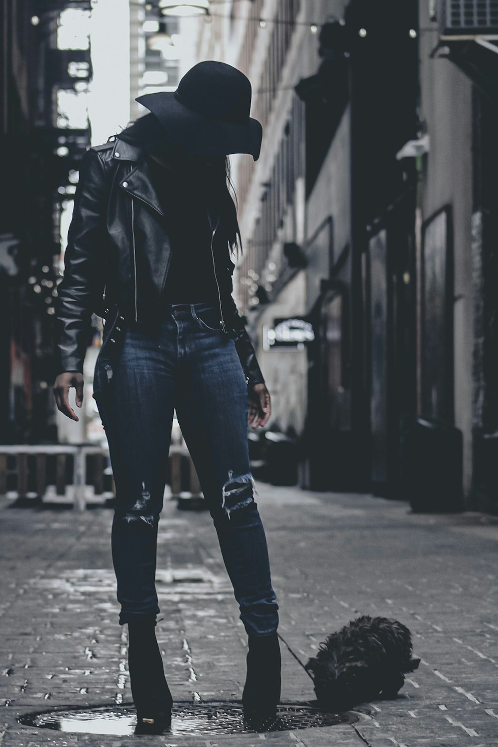 woman wearing black leather jacket