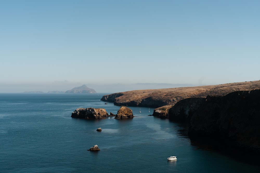 aerial photography of sea and mountain