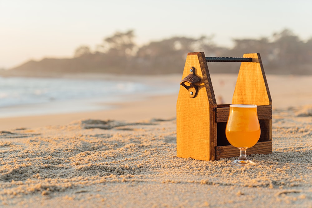 filled cup on shore