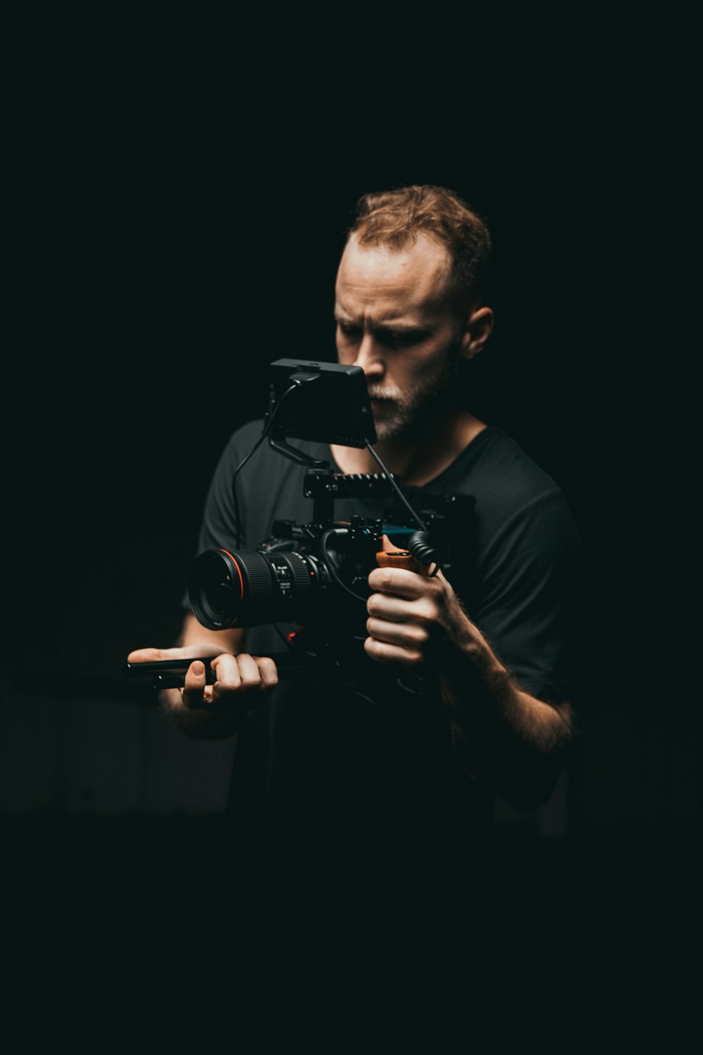 man holding video camera