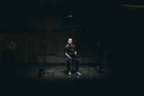 man sitting on bar stool