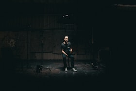 man sitting on bar stool