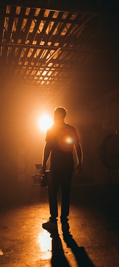 silhouette photography of man inside building