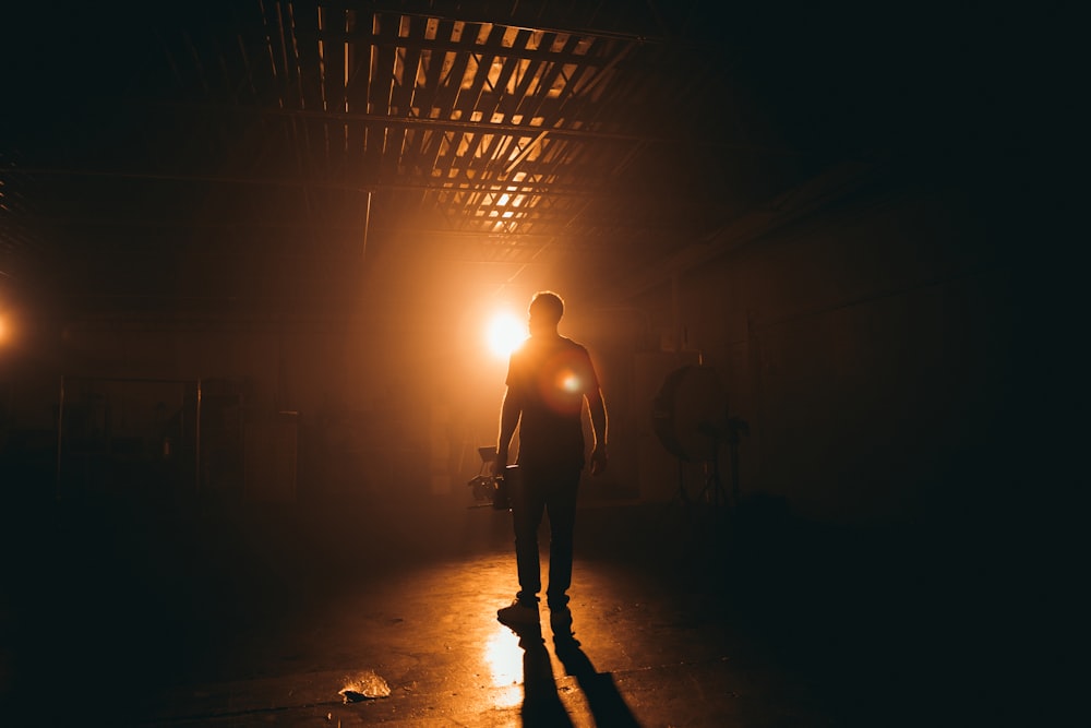 silhouette photography of man inside building