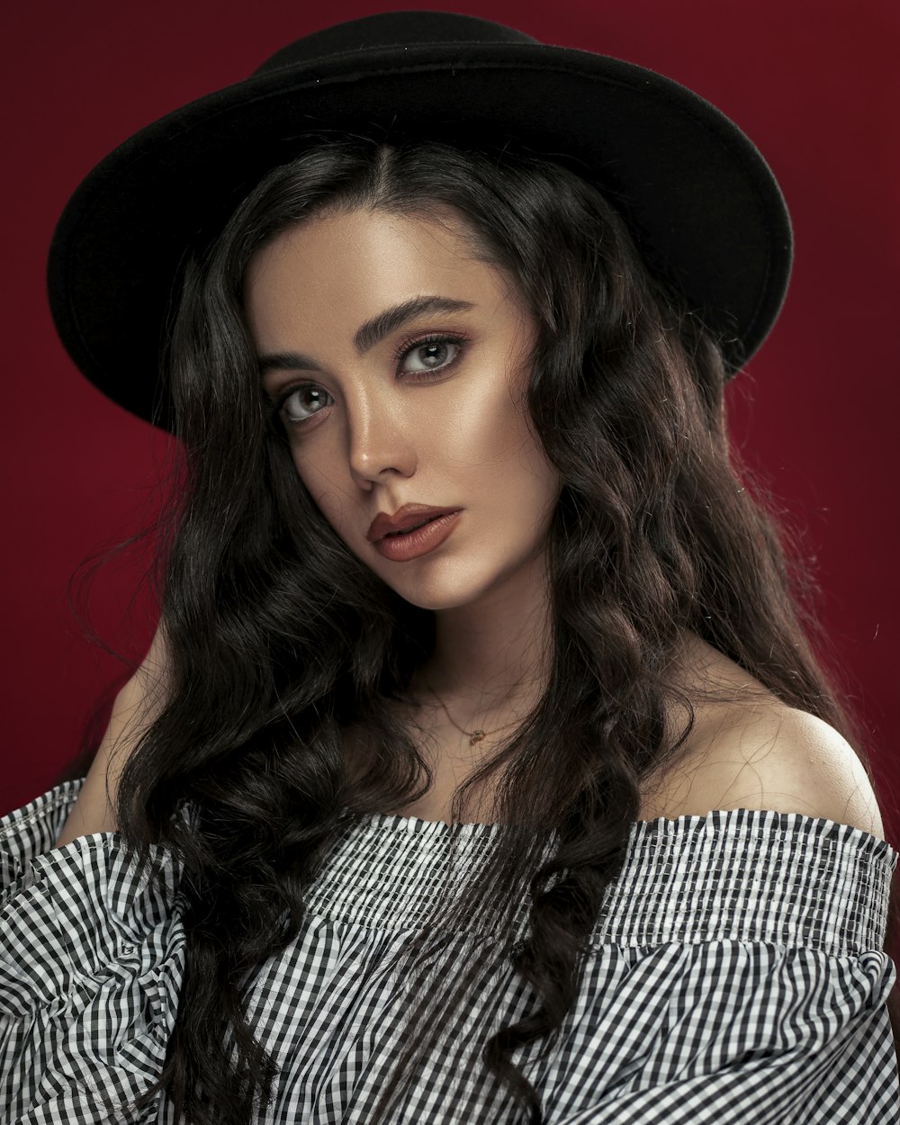 woman in black and gray tube top and black hat