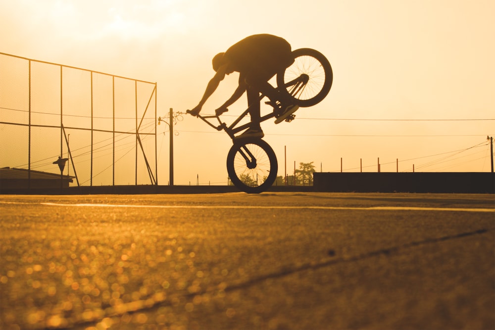 person riding BMX bicycle