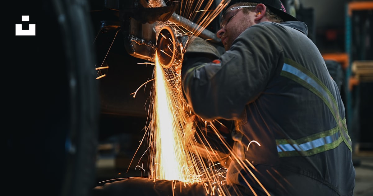 Man doing machine tool photo – Free Building Image on Unsplash