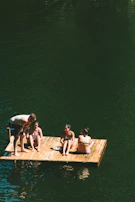 A group of friends enjoying a sunny day on a rubber dinghy