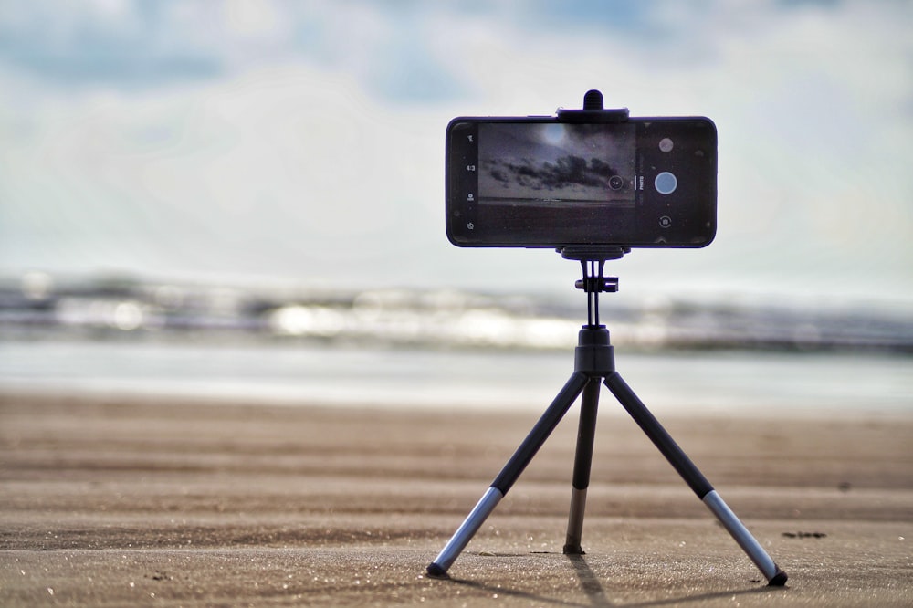 black smartphone near shore