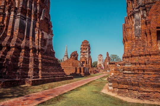 ruins during day in Wat Phra Mahatat Thailand
