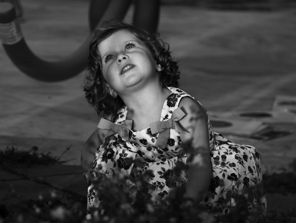grayscale photo of girl in sleeveless floral dress