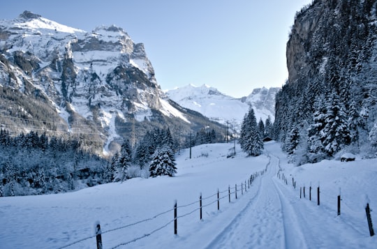 road beside snow-capped mountain in Blausee Switzerland