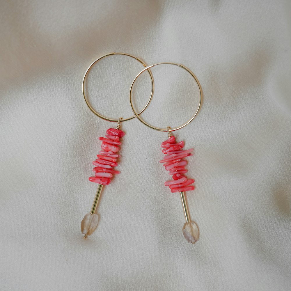 pair of gold-colored earrings