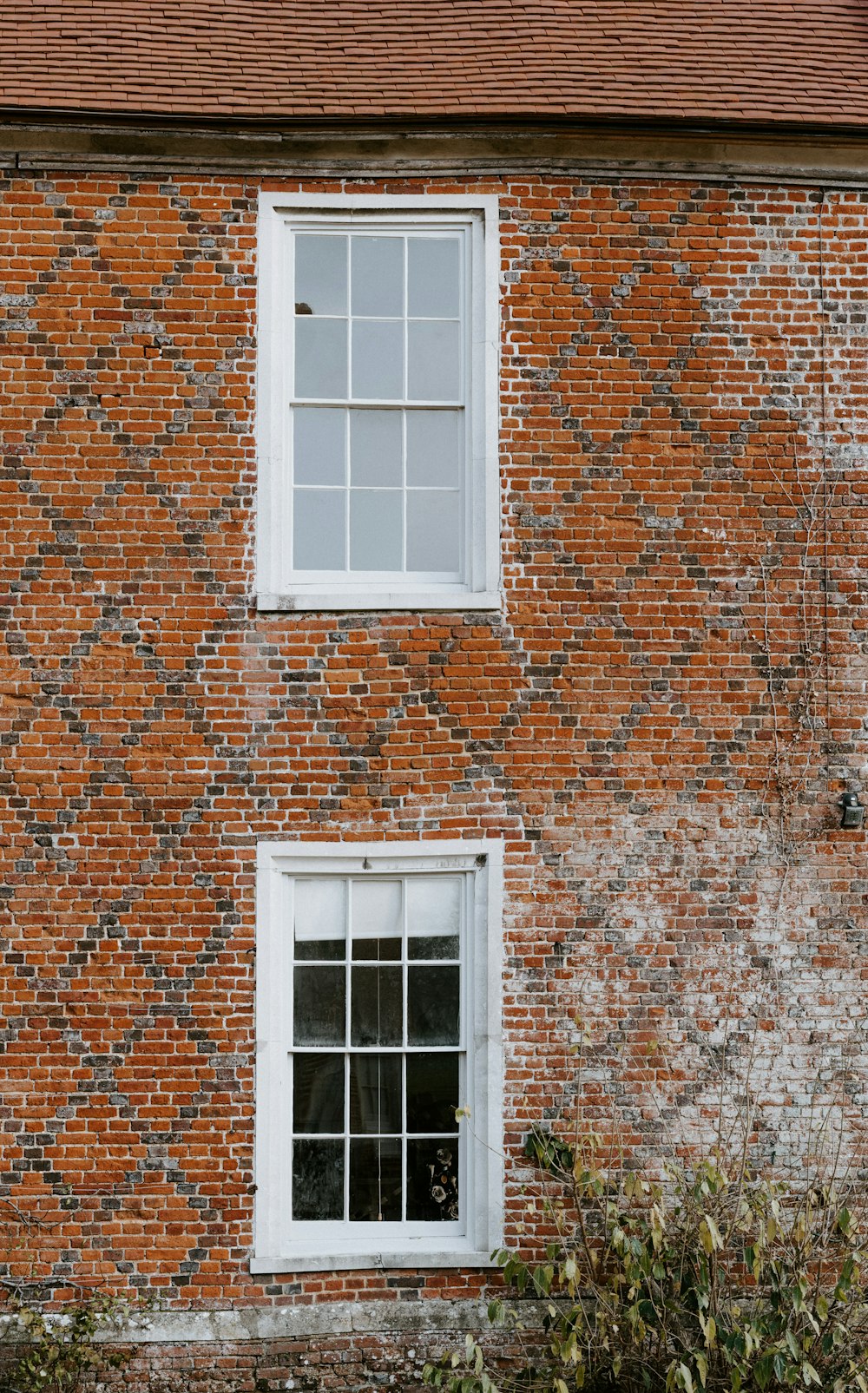 brown brick building with windows