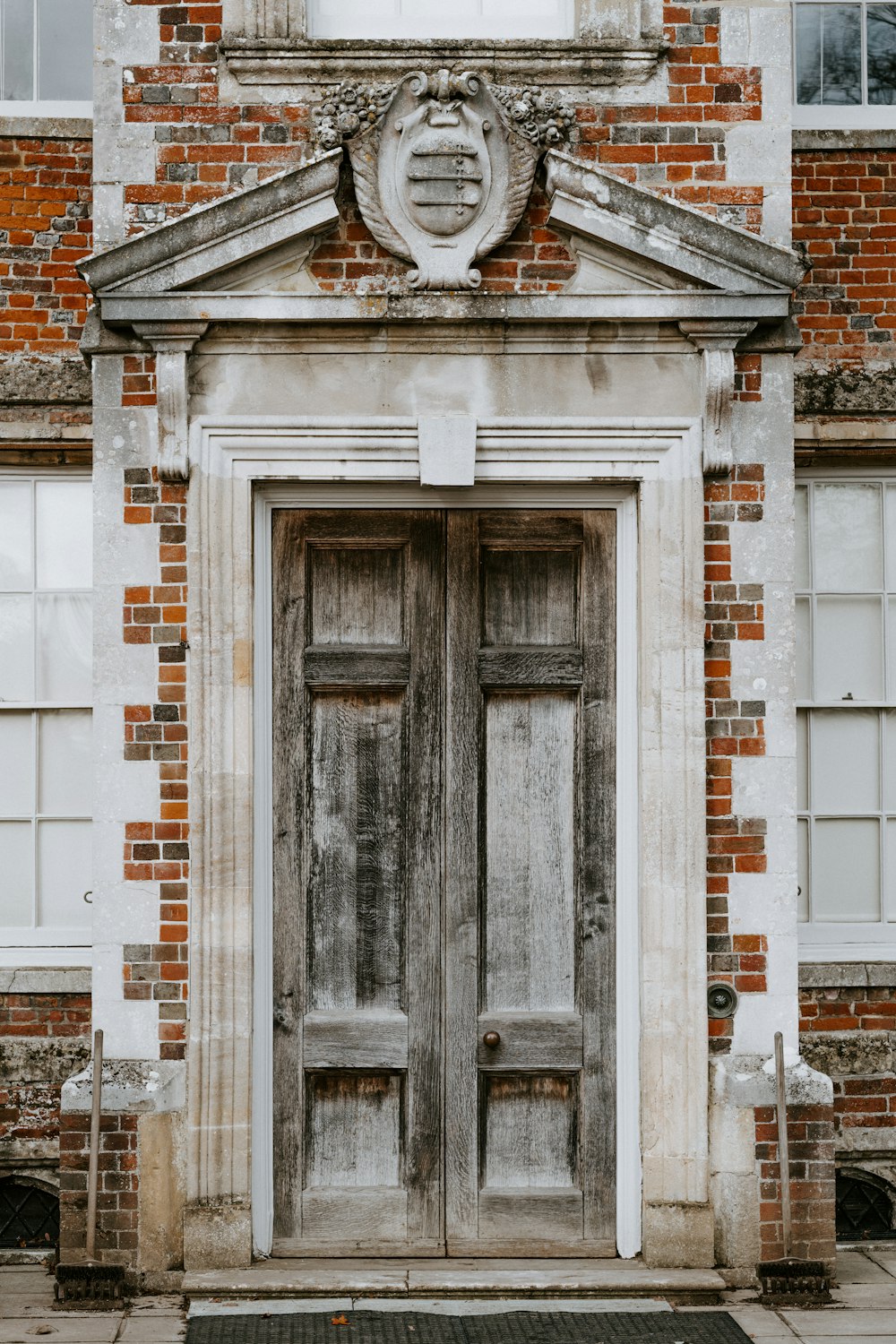 an old brick building with two double doors