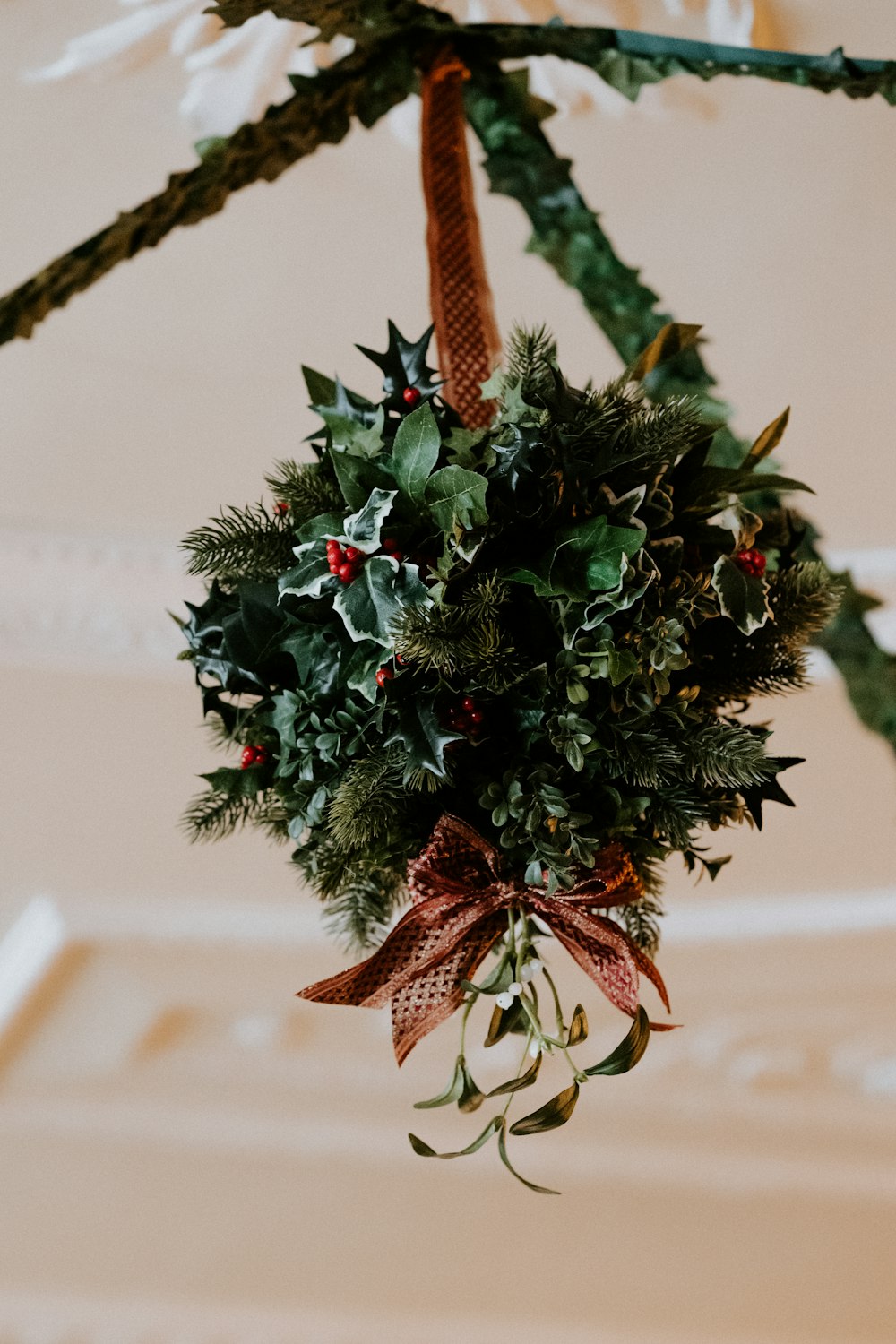 selective focus photography of green Christmas ornament