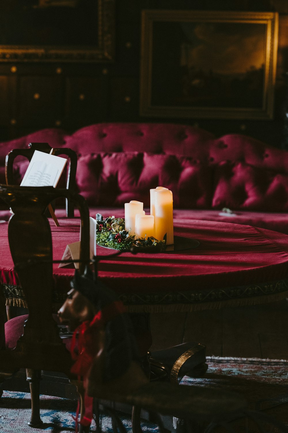 LED pillar candles on table top inside a lighted room