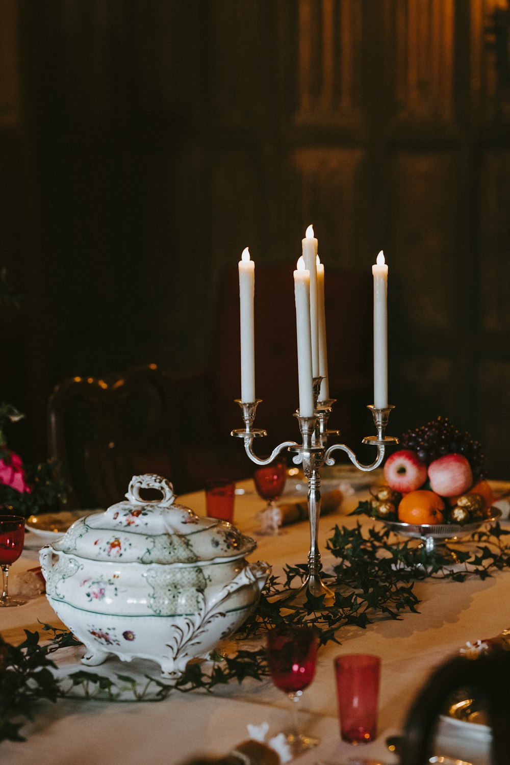 lighted candles on candelabra at table top