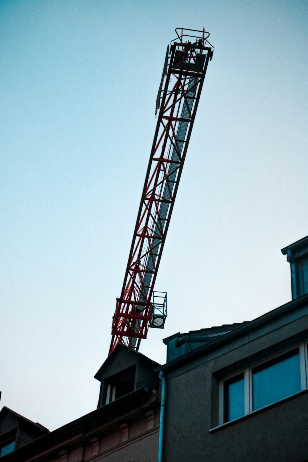 brown crane on top of house