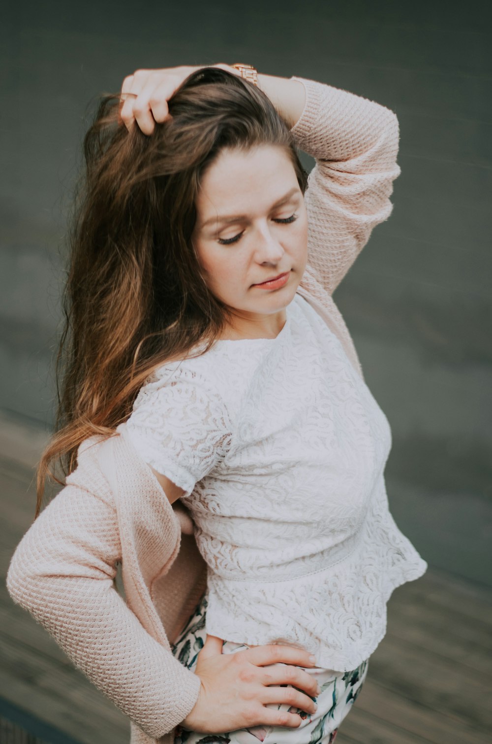 woman wearing pink crew-neck sweater