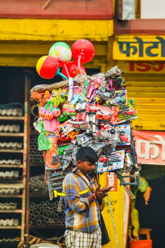 man carrying toys in Pokhara Nepal