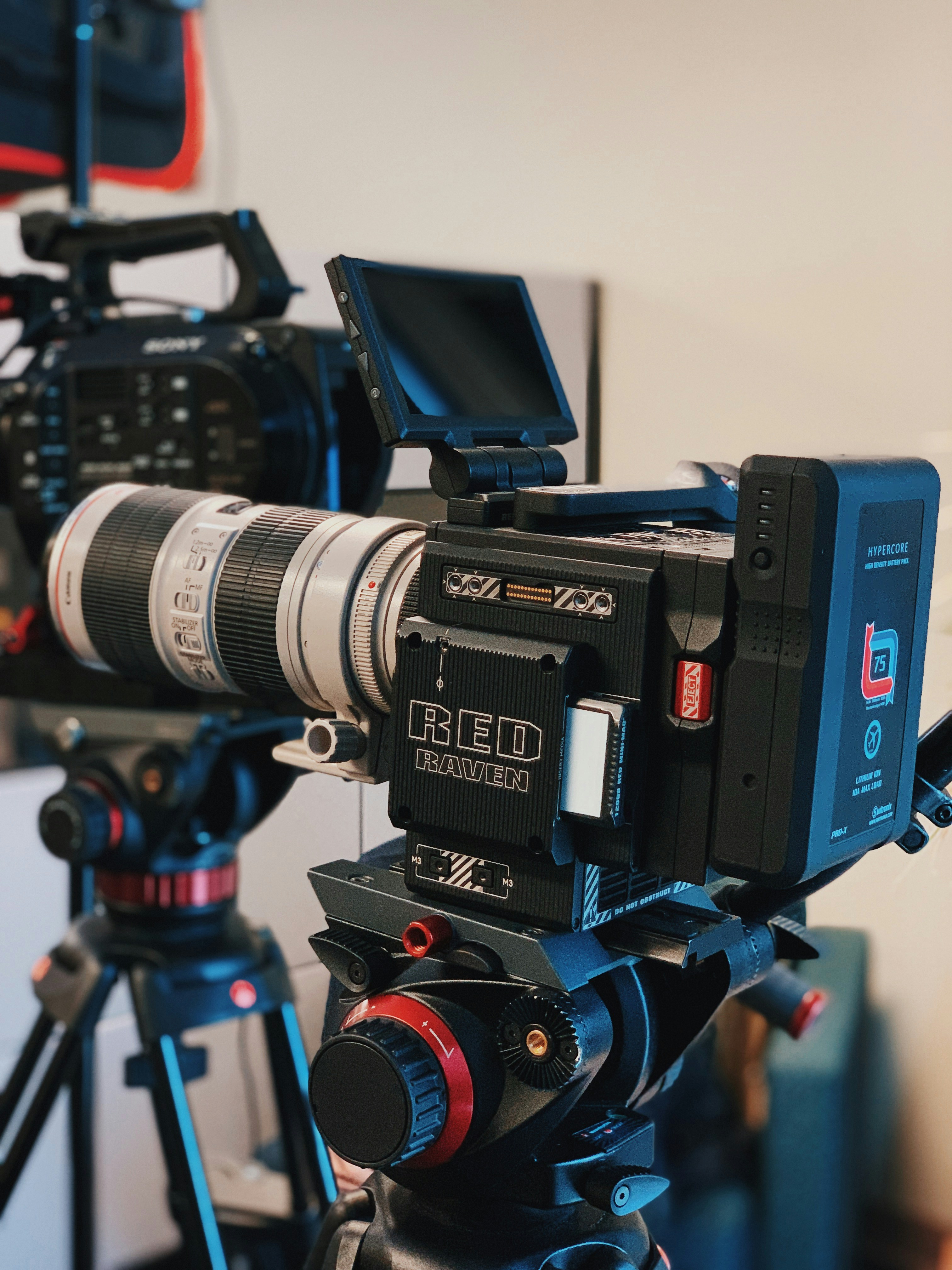 Black and red camera tripod photo Free Red Image on Unsplash