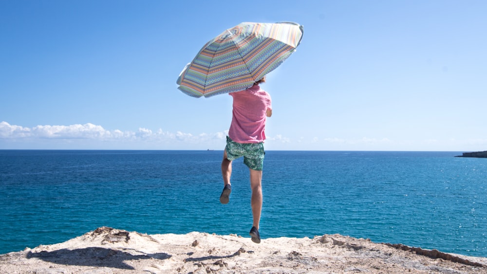 person holding umbrella during daytime