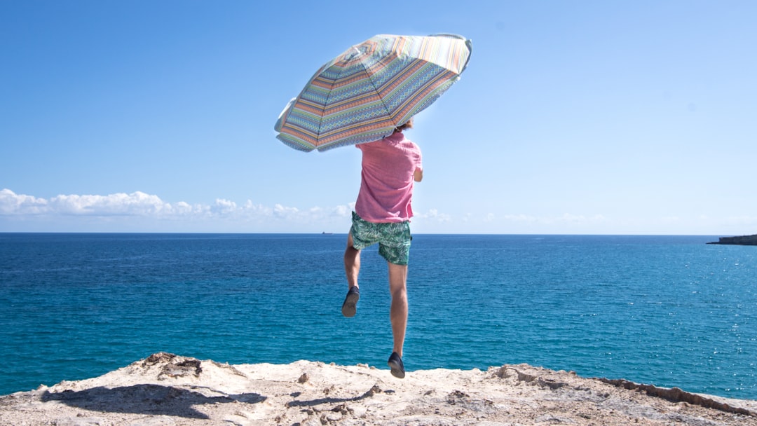 person holding umbrella during daytime