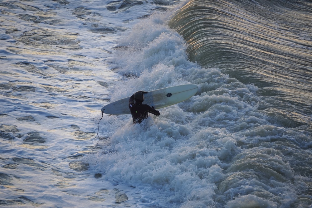man surfing photograph