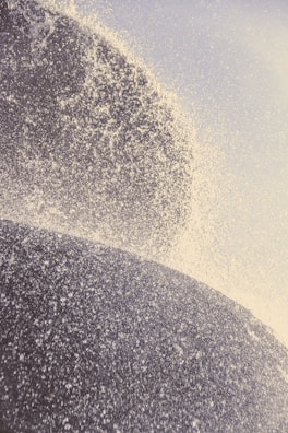 Close-up of water droplets sparkling as they fall from a Tahitian cascade.