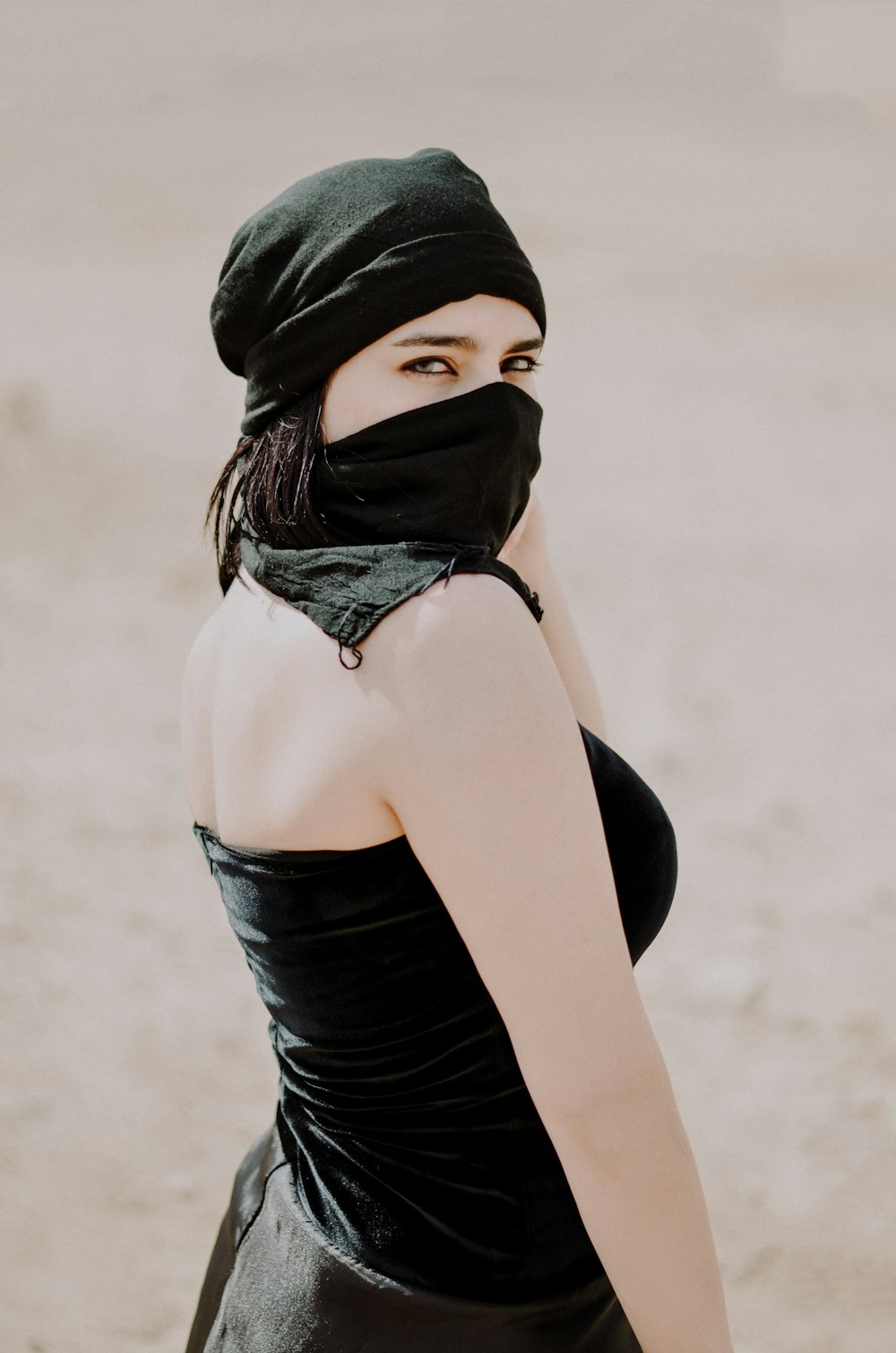 woman wearing niqab and black tube dress