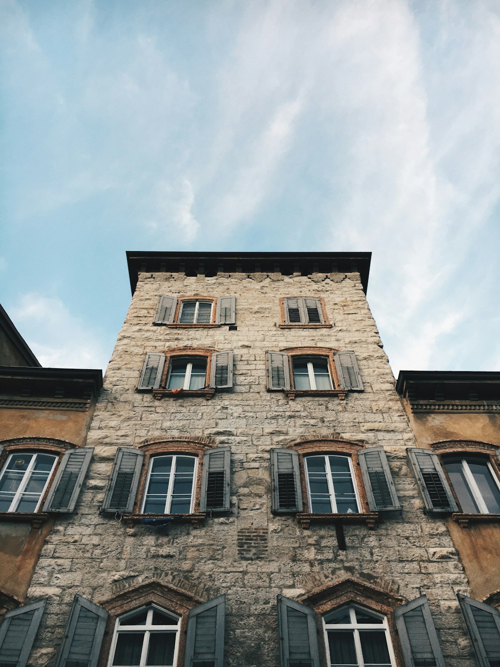 low angle photo of brown concrete building