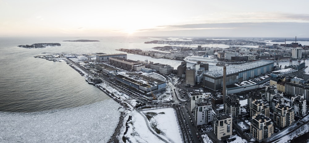 an aerial view of a city and a body of water