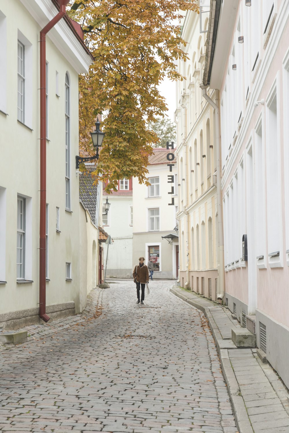 unknown person walking on alleyway