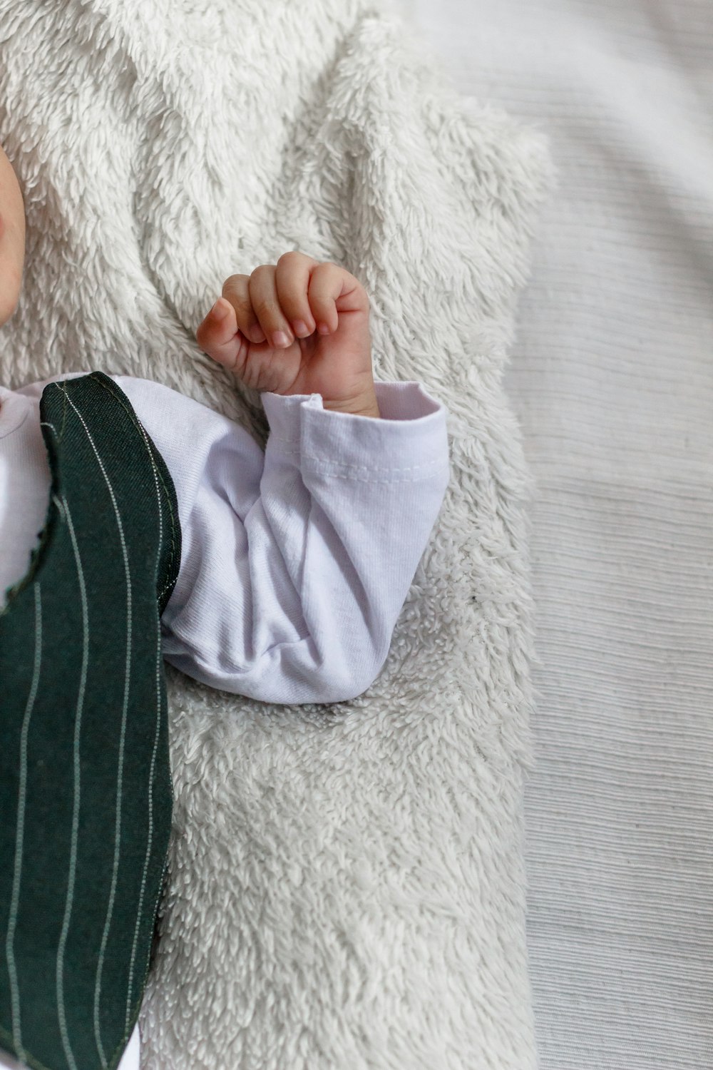 boy on white fleece mat