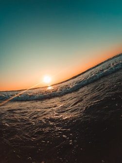a person riding a surfboard on a wave in the ocean
