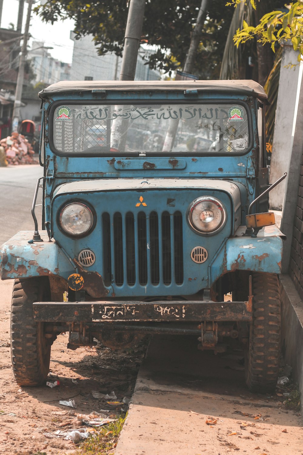 blue Mitsubishi off-road vehicle