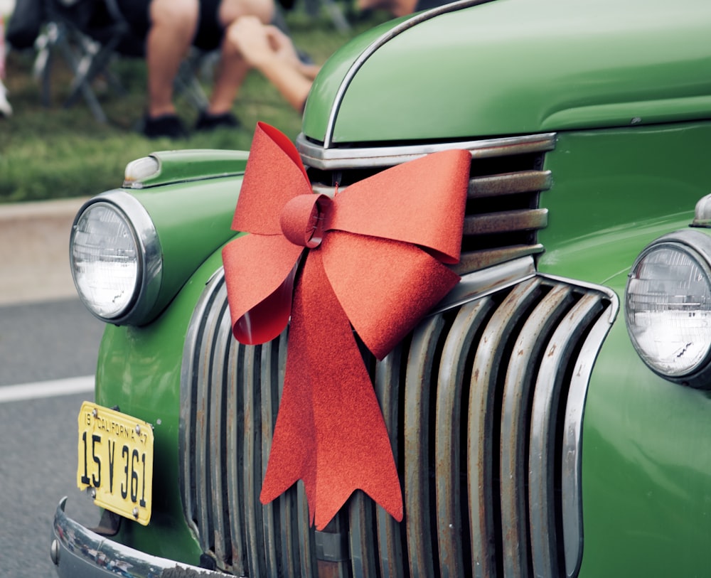 red ribbon on car hood