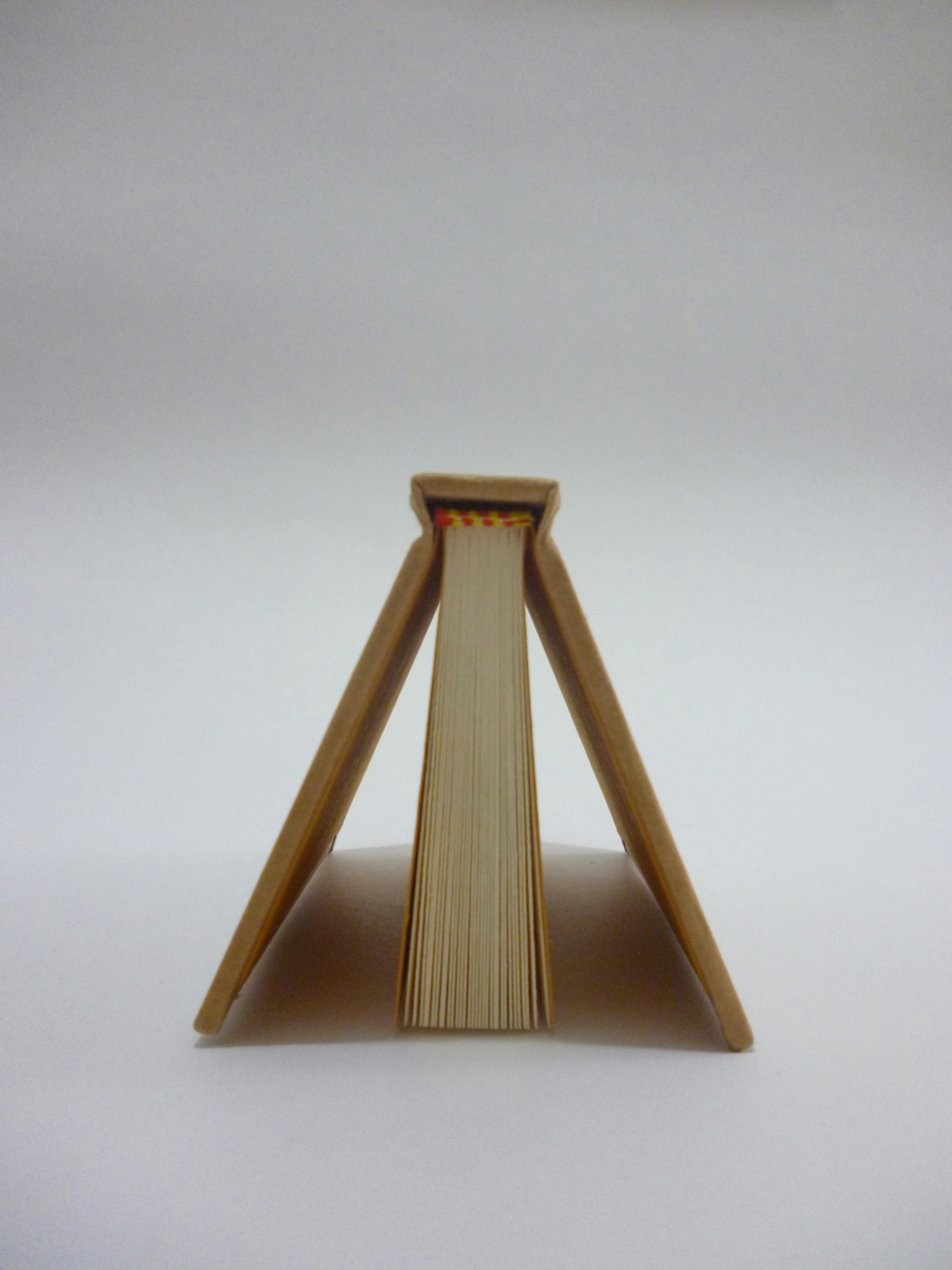 brown book standing upside down