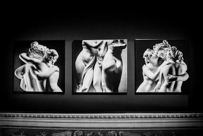 Black and white photographs of classical sculptures depict groups of intertwined figures. The images capture the artistic representation of human forms with detailed attention to anatomy and emotion. The figures exhibit intricate expressions and gestures that communicate intimacy and fluidity.