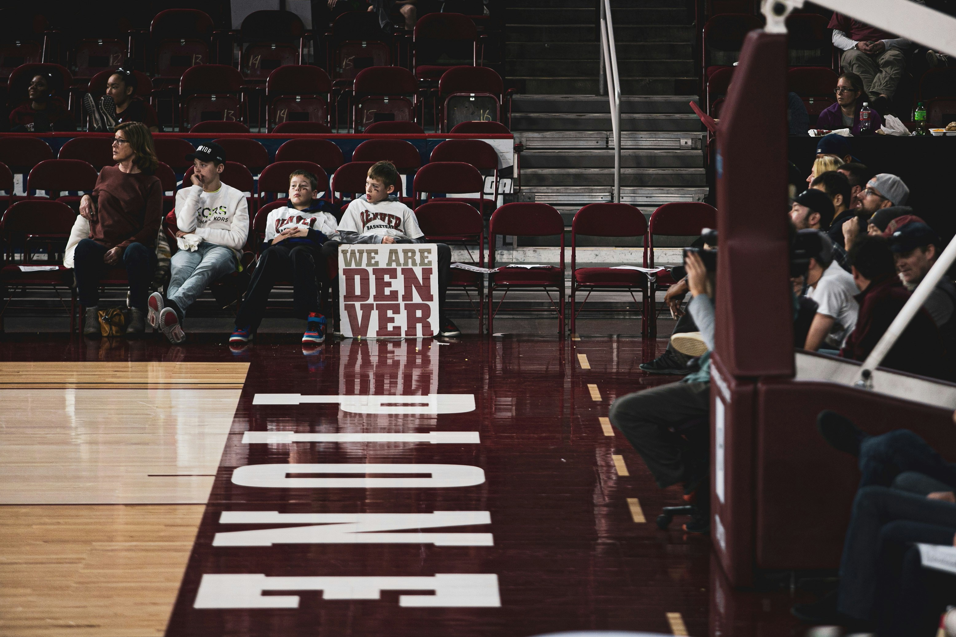 People Sitting On Individual Chairs While Watching Basketball Game
